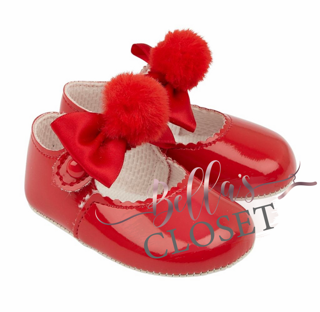 Patent leather red crib shoe with pom pom